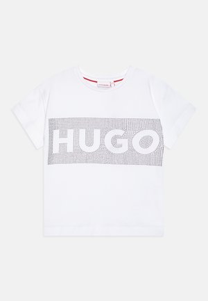 White cotton t-shirt featuring a silver rhinestone "HUGO" logo across the chest, short sleeves, and a round neckline.