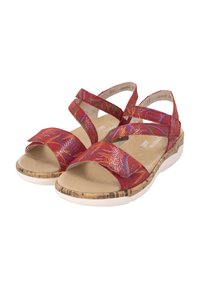 Sandales rouges à lanières avec une tige synthétique texturée, semelle en liège et semelle extérieure en caoutchouc blanc. Présente des motifs tissés colorés et des sangles ajustables.