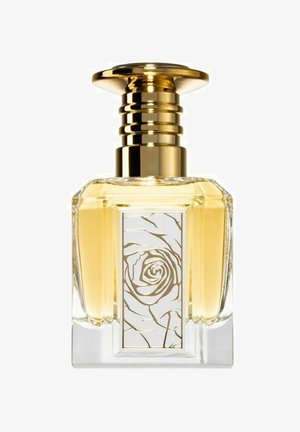 Läpinäinen lasinen hajuvesipullo, jossa on kultasävyinen metallikorkki. Etiketissä on valkoinen tausta, johon on painettu kultainen ruususuunnitelma. Sisältää vaaleankeltaista nestettä.