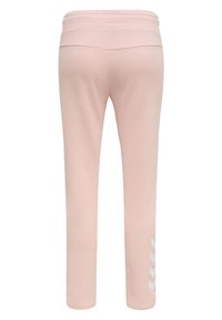 Ljusrosa joggerbyxor med en mjuk textur, elastisk midja och ett vitt sicksackmönster på vänster ben. Enkelt, raka bendesign.