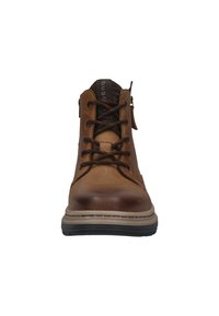 Bruine leren veterschoenen met een gladde afwerking, rubberen zool en een stoffen voering. Heeft een rits en een gestikte ontwerp langs de randen.