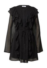 Schwarzes Kleid mit rüschengestaltetem Vorderteil, langen transparenten Ärmeln und einer taillierten Taille mit Kordelzug. Punktenmuster über den gesamten Stoff.