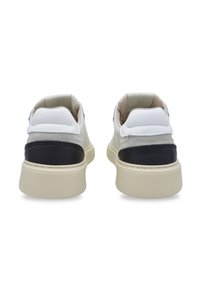 Footwear with white leather, gray suede, and black leather accents. Features a beige rubber sole and padded collar for comfort.