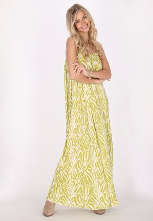 Robe maxi en vert lime vibrant avec un motif abstrait blanc. Fabriquée en tissu léger, elle présente une coupe ample et un design sans bretelles.