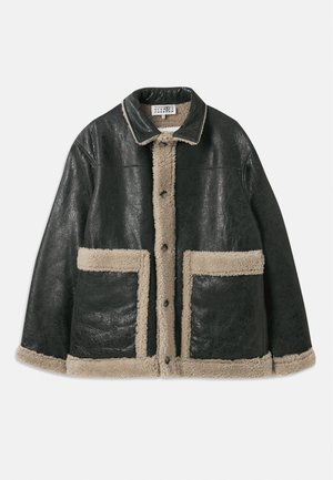 Black leather jacket with a beige shearling lining, featuring large front pockets and a classic collar. Buttons run down the front.