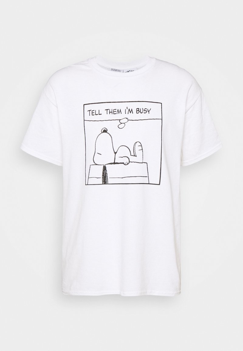 White t-shirt with black line drawing of Snoopy lying on his doghouse and text above saying "TELL THEM I'M BUSY".