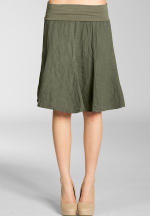 Olive green knee-length skirt made of textured fabric with a wide elastic waistband and a flared shape, featuring subtle stitching details.