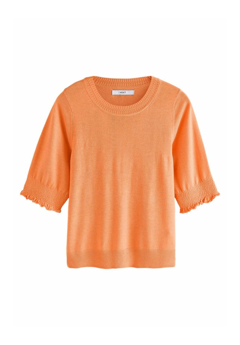 Maglione arancione lavorato a maglia con scollatura rotonda, maniche corte con dettagli arricciati e orlo a costine. Texture liscia.
