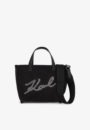 Borsa tote nera con manici corti, ampia tracolla regolabile e "Vol" scritto in strass argentati sul pannello anteriore.