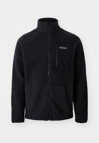 Zwarte fleece jas met hoge kraag, volledige ritssluiting aan de voorkant en een ritszak op de borst. Geweven, zachte stof met minimale naden.
