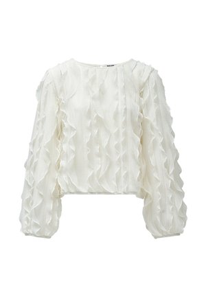 Blusa blanca corta con detalles de volantes en el frente y las mangas, hecha de una tela texturizada ligera. Escote redondo.