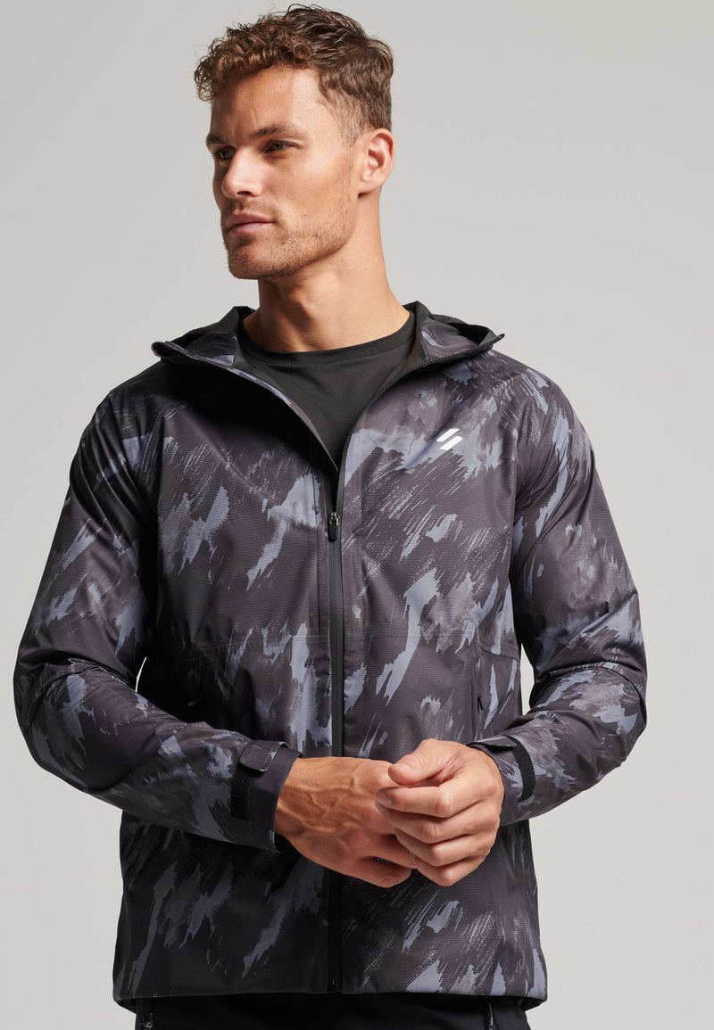 Superdry Waterproof jacket brush camo dark/blue Zalando.co.uk