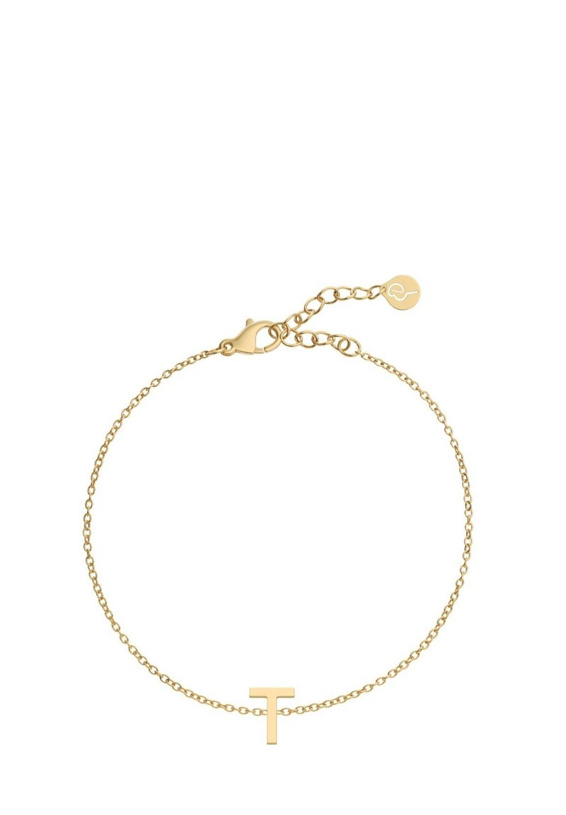 Zelta krāsas aproce ar smalku ķēdīti, kas rotāta ar minimālistisku 'T' piekariņu. Aprocessing ar asti un regulējamu garumu, kā arī neliela akcenta birka.