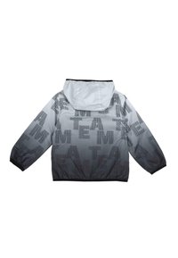 Veste coupe-vent grise avec imprimé texte noir. Comprend une capuche, des poignets élastiques et une coupe décontractée. Les motifs de texte incluent "TEAM" et "LOVE".