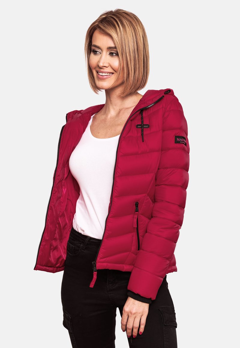 Red puffer jacket with a hood, featuring a zippered front and two side pockets. Made from quilted material with elastic cuffs and notable branding.
