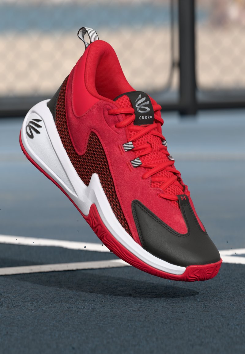 Red athletic shoes featuring a suede upper, mesh accents, black leather toe, white midsole, and textured red outsole. Branding visible on tongue.