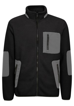Giacca in fleece nera con accenti grigi. Presenta una chiusura a zip completa, due tasche con zip e un tessuto testurizzato con pannelli lisci sulle maniche.