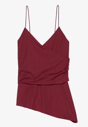 Top burgundy fără mâneci, cu guler în V, hem asimetric și textură gathered pe o latură. Fabricat dintr-un material moale și elastic.