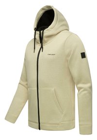Felpa con zip di colore beige, con una trama a coste, cordini neri e tasche. Presenta un'etichetta con logo nera sul maniche e un design con cappuccio.