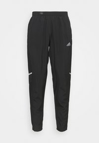 Schwarze Sporthose mit elastischem Bund, ausgestattet mit reflektierenden Akzenten und seitlichen Taschen zur Aufbewahrung. Leichtes, glattes Material.