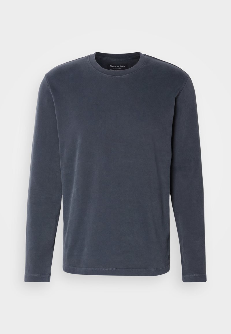 Langärmliges, marineblaues Hemd aus weicher Baumwolle. Mit Rundhalsausschnitt und geradem Schnitt. Minimalistisches Design, keine zusätzlichen Muster oder Akzente.