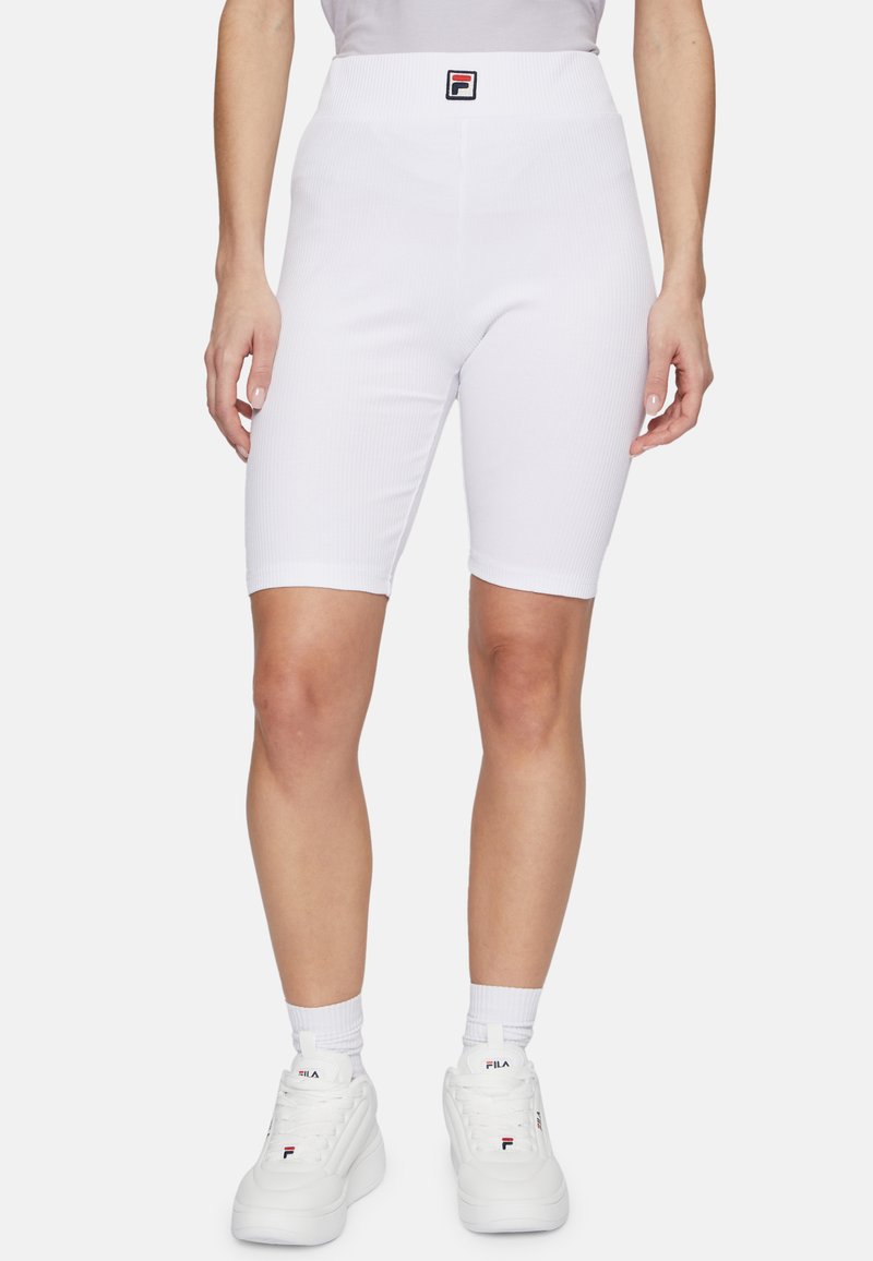 Shorts da ciclismo bianchi a coste con vita alta e un piccolo logo nero e rosso. Il materiale sembra elastico e aderente.