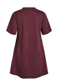 Maroon short-sleeve dress with a round neckline, soft texture, and a relaxed fit, designed to fall just above the knee. No visible patterns.
