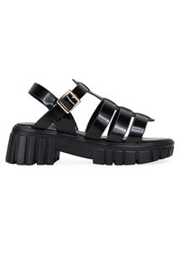 Sandali neri con cinturini in materiale sintetico lucido, caratterizzati da un tacco largo e scanalato e una cinturino regolabile con fibbia dorata.