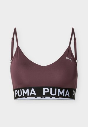 Brassière de sport bordeaux avec bretelles fines réglables, bande élastique noire avec texte blanc "PUMA", et petit logo Puma sur le côté gauche.