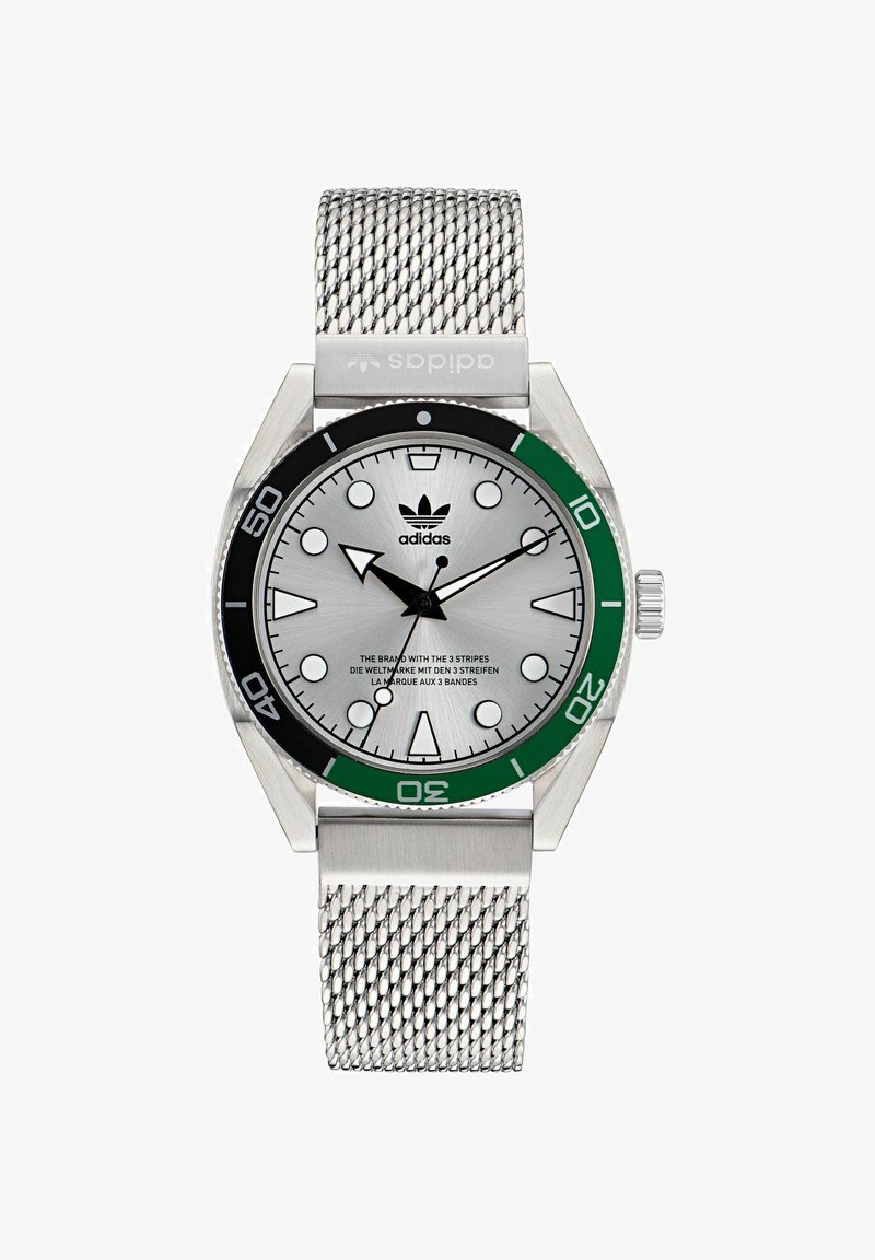 Silver stainless steel watch with a green and black bezel. Mesh strap and a textured silver dial with bold hour markers and hands. Adidas logo displayed.