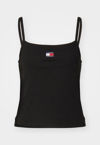 Top in cotone nero a coste con spalline sottili, caratterizzato da un piccolo logo multicolore di Tommy Jeans sul davanti. Design semplice e forma aderente.