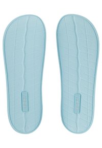 Light blue foam insoles with a textured pattern and Roxy branding. The shape is contoured for comfort, featuring grooves for traction.