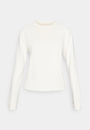 Pulover alb cu mânecă lungă, dintr-un material texturat, cu decolteu rotund și manșete ajustate. Design simplu, fără modele sau accente vizibile.