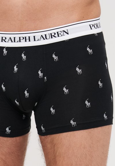 Fekete boxer alsónadrág, ismétlődő fehér polo játékos logó mintázattal. Rugalmas derékpánt, rajta "Ralph Lauren" és "Polo" márkajelzésekkel.
