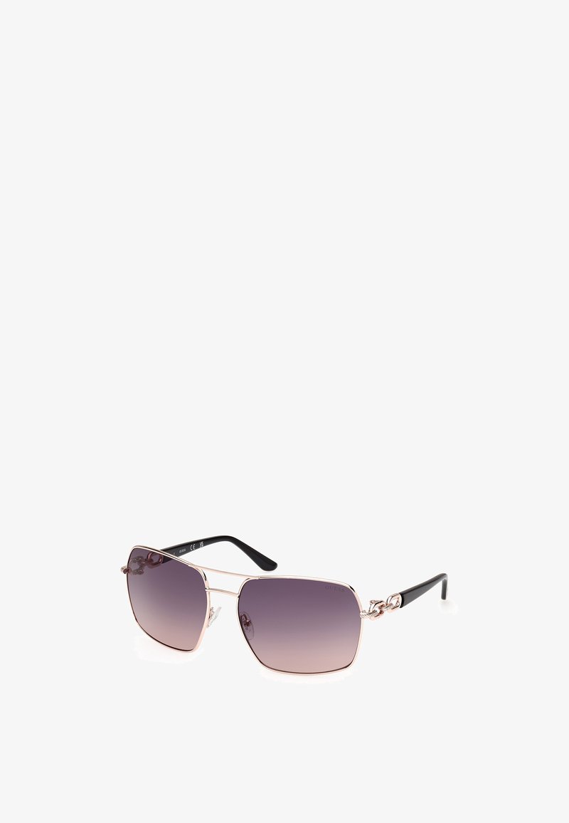 Angular sunglasses with gradient purple lenses, metallic light pink frames, and black plastic arms featuring decorative hardware accents.