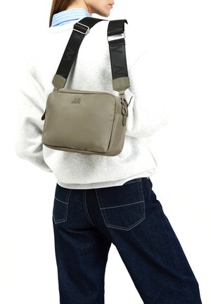 GERANI - Cross body bag - light green