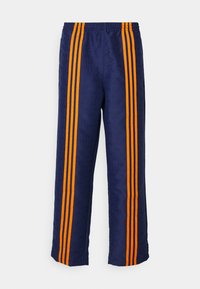 CLUB TRACKPANTS - Verryttelyhousut - night indigo