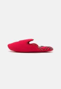 Red felt slipper with a pointed toe, open back, and plaid lining. Smooth texture and curved shape designed for comfort and ease of wear.