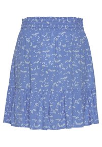 Jupe bleue avec petit imprimé floral blanc, taille élastique et ourlet à volants.