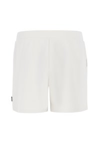 Pantaloni sportivi bianchi realizzati in tessuto testurizzato, con un design semplice, una vita elasticizzata e un piccolo dettaglio logo sul lato.