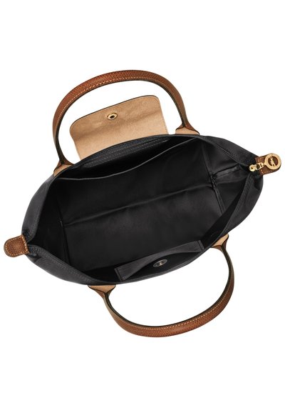 Black leather handbag with brown textured handles and a tan interior. Features a zip closure and one interior pocket with a snap.