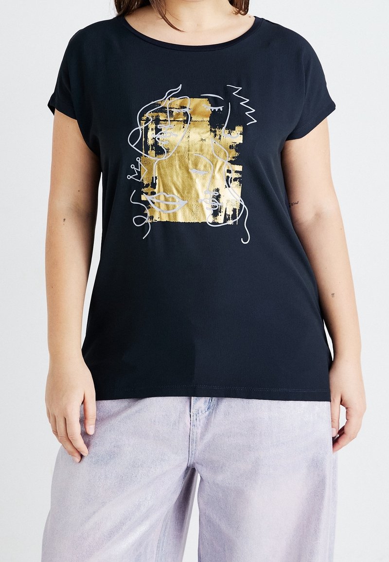 Black short-sleeve t-shirt featuring a gold and white abstract graphic design. Smooth fabric with a relaxed fit. Lightly textured accents.