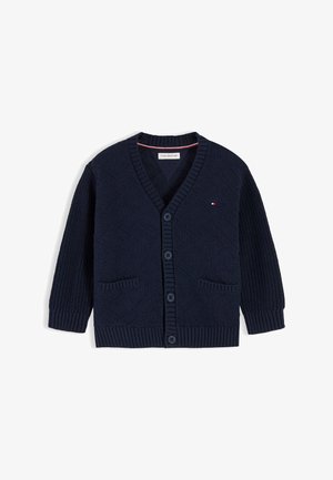 Marineblauer Strickcardigan mit V-Ausschnitt, Knopfverschluss, zwei Fronttaschen und kleinem Tommy Hilfiger-Logo auf der Brust.