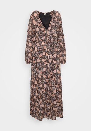 Pitkä kukkamekko tummasta kankaasta, jossa on syvä V-päänkaula, pitkät hihat ja kireä vyötärö. Kuosissa on persikan värisiä kukkia ja vihreitä lehtiä.