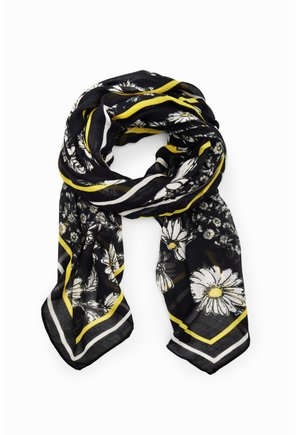 Schwarzer Schal mit weißen und gelben Gänseblümchenmustern, mit gelb-weißen gestreiften Rändern, locker auf einem weißen Hintergrund gefaltet.