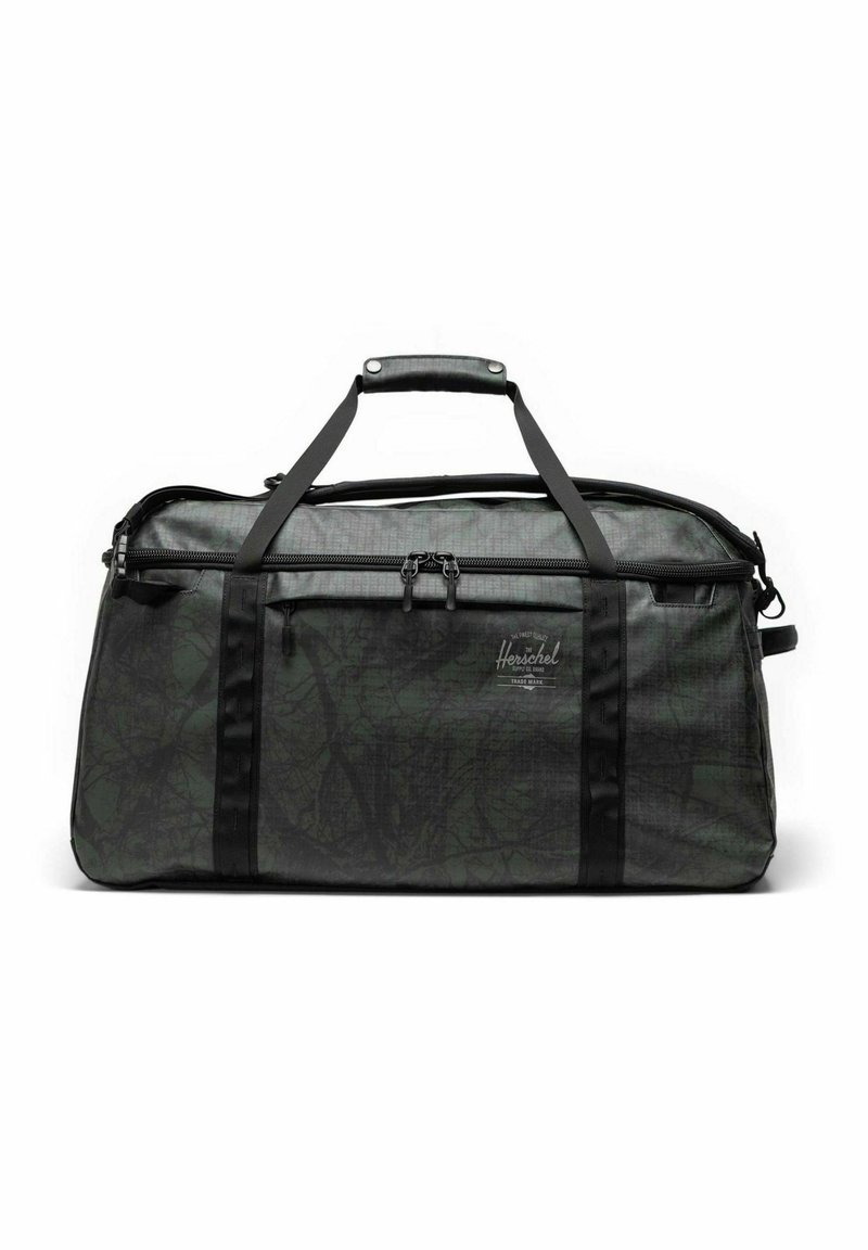 Sac de sport Herschel noir et vert foncé avec deux poignées supérieures, poche zippée sur le devant et motif de feuilles subtil sur le tissu.
