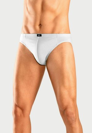 Weiße Baumwollslips mit elastischem Bund, versehen mit einem kleinen schwarzen Etikett. Das Design hat eine enganliegende Passform und minimale Nähdetails.