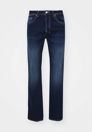 Donkerblauwe denim jeans met een rechte pijp ontwerp, voorzien van een ritssluiting, vijf zakken en contrasterende gele stiksels.