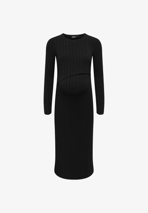 Zwarte geribbelde zwangerschapsjurk met lange mouwen en een gebogen voorkantnaad, ontworpen voor een strakke silhouette. Zachte stoftextuur.