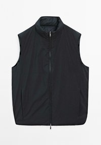 Gilet sans manches noir avec col montant et double fermeture éclair centrale, conçu pour offrir une chaleur légère et se superposer facilement.